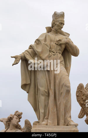 Baroque statue of Saint Francis Borgia by Czech sculptor Ferdinand Maxmilián Brokoff on the Charles Bridge in Prague, Czech Republic. The current statue on the bridge is a copy dated from 2018-2019 after an original dated from 1710. Stock Photo