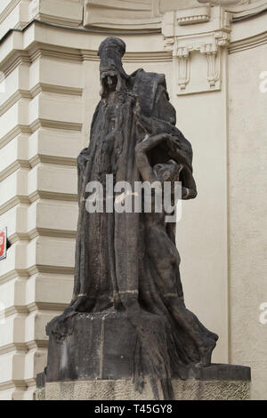 Statue of Rabbi Lowe (Judah Loew ben Bezalel) by Czech sculptor Ladislav Šaloun on the Prague New City Hall (Nová radnice) in Mariánské Square in Staré Město (Old Town) in Prague, Czech Republic. The Art Nouveau building designed by Czech architect Osvald Polívka was built in 1908-1911. Stock Photo