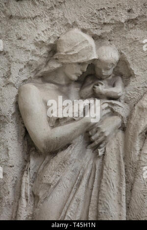 Art Nouveau relief by Czech sculptor Stanislav Sucharda flanking the main entrance to the Prague New City Hall (Nová radnice) in Mariánské Square in Staré Město (Old Town) in Prague, Czech Republic. The Art Nouveau building designed by Czech architect Osvald Polívka was built in 1908-1911. The relief on the left side depicting: Citizens bearing a load together, i.e. it stresses out the principle of group work and obligations. Stock Photo