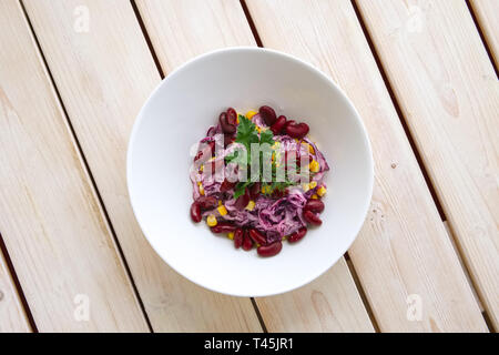 Vegetarian salad with red cabbage, red beans and corn Stock Photo
