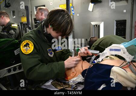 U.S. Air Force Staff Sgt. Lauren Rosenhoover, a cardiopulmonary technician with the 140th Medical Group, Colorado Air National Guard, conducts training as part of the Critical Care Air Transport Team for aeromedical evacuation of patients during disaster response on a C-17 Globemaster III, March 5th 2019, at the Savannah Air National Guard Base, Georgia. PATRIOT South 19, a domestic operations disaster-response training exercise conducted by National Guard units working with federal, state and local emergency management agencies and first responders. (Air National Guard Stock Photo