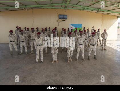 Rapid Intervention Battalion (RIB) soldiers from the Djiboutian army’s elite military force stand in formation during an NCO course graduation at a training location near Djibouti, March 7, 2019. U.S. Soldiers with 1-26 Infantry Battalion, 2nd Brigade Combat Team, 101st Airborne, assigned to Combined Joint Task Force-Horn of Africa, taught the course to the RIB soldiers. Stock Photo