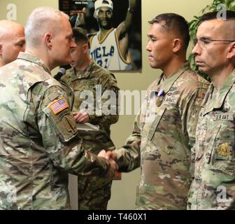 Maj. Gen. John Evans, commander of U.S. Army Cadet Command, presents ...