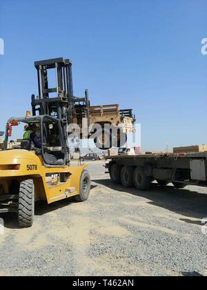 420th Transportation Battalion coordinates contracted assets to move 3d Armored Brigade Combat Team, 4th Infantry Division equipment from port to Camp Buehring, Kuwait, Feb. 28, 2019. Stock Photo