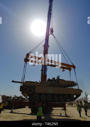 420th Transportation Battalion coordinates contracted assets to move 3d Armored Brigade Combat Team, 4th Infantry Division equipment from port to Camp Buehring, Kuwait, Feb. 28, 2019. Stock Photo