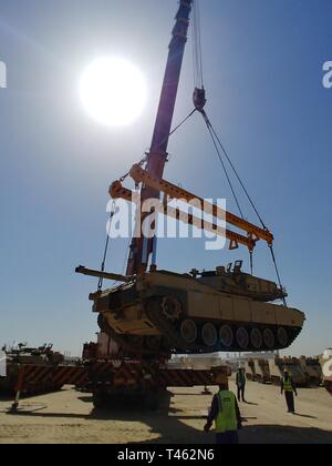 420th Transportation Battalion coordinates contracted assets to move 3d Armored Brigade Combat Team, 4th Infantry Division equipment from port to Camp Buehring, Kuwait, Feb. 28, 2019. Stock Photo