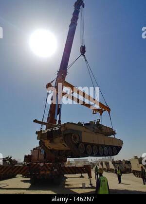 420th Transportation Battalion coordinates contracted assets to move 3d Armored Brigade Combat Team, 4th Infantry Division equipment from port to Camp Buehring, Kuwait, Feb. 28, 2019. Stock Photo