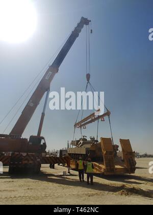 420th Transportation Battalion coordinates contracted assets to move 3d Armored Brigade Combat Team, 4th Infantry Division equipment from port to Camp Buehring, Kuwait, Feb. 28, 2019. Stock Photo