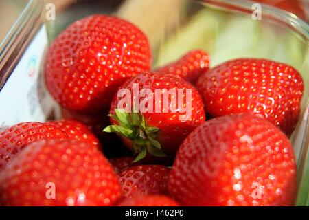 Punnet of fresh strawberries close up Stock Photo