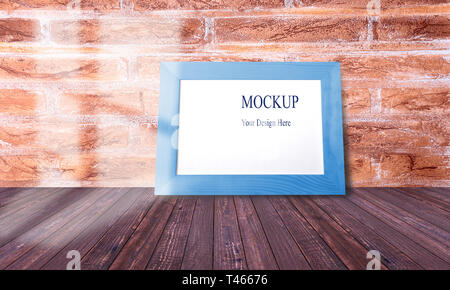 Wood narrow photo frame with mock up space on wall. Stock Photo