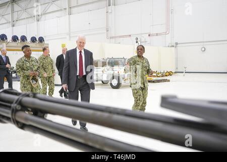 PENSACOLA, Fla. (March 13, 2019) Aviation Ordnanceman 2nd Class Sydney Smith, right, an instructor at Naval Air Technical Training Center (NATTC), describes how naval aviation ordnance technicians are taught to Charles Drummond, deputy assistant secretary of defense for education and training in the Office of the Assistant Secretary of Defense for Readiness.  Drummond toured NATTC during a visit to Pensacola that also included Naval Education and Training Command, where he discussed topics such as credentialing; Ready, Relevant Learning; and information technology transformation initiatives. Stock Photo