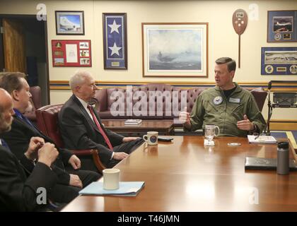 PENSACOLA, Fla. (March 13, 2019) Rear Adm. Kyle Cozad, commander of Naval Education and Training Command, right, discusses the “street to fleet” process and training initiatives with Charles Drummond, deputy assistant secretary of defense for education and training in the Office of the Assistant Secretary of Defense for Readiness. Stock Photo