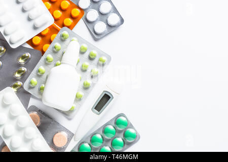 Tablets and medicines on a white top view. Stock Photo