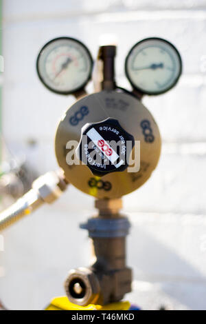valve and pressure gauges on inert gas cylinder bottle with shallow depth of field Stock Photo