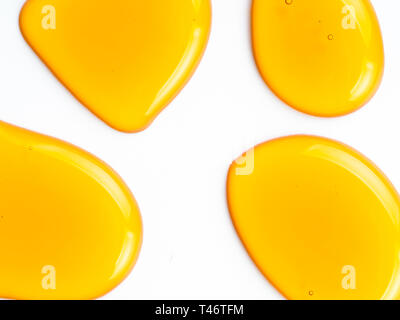 Honey drops. Abstract pattern from honey drops. Isolated on white with clipping path. Can use for design. Copy space for text. Stock Photo