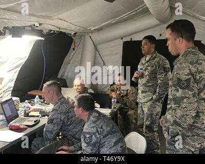 Members of the 263rd Combat Communications Squadron participate in the Combat Communications (CBC) Rodeo while at Robins Air Force Base, Georgia, Mar. 13, 2019. The CBC Rodeo is a Nationwide training exercise that brings together Combat Communications Squadrons from across the country to train in techniques and skills while networking to increase the potential success of future deployments. Stock Photo