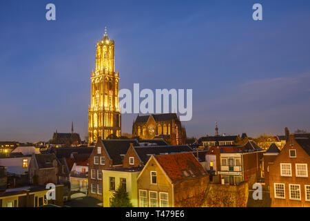 The Strosteeg (Straw Alley) and the illuminated Dom Tower of the Saint Martins Cathedral at sunset, Utrecht, The Netherlands. Stock Photo