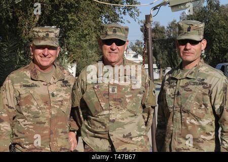 Command Sgt. Maj. Lester Edwards, 108th Sustainment Brigade, Command Sgt. Maj. Jason Little, 184th Sustainment Command, and Command Sgt. Maj. Ronald Hassler, 103rd Sustainment Command, in Taji, Iraq, March 11, 2019. Stock Photo