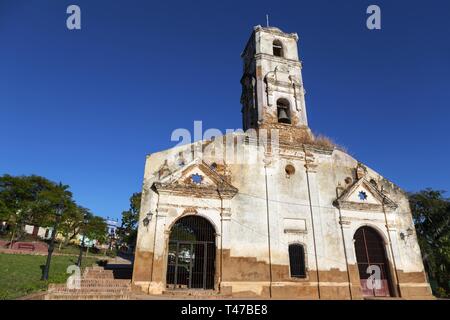 Front Facade Wall Exterior of old ruined Spanish church with Bell Tower in Unesco World Heritage Site Trinidad, Cuba Stock Photo