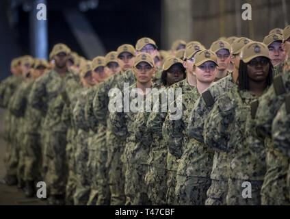 DIEGO (March 15, 2019) — Sailors assigned to the amphibious assault ship USS Makin Island (LHD 8) stand in formation during a change of command ceremony held in the ship’s well deck. During the ceremony, Capt. Christopher Westphal relieved Capt. David Oden as the commanding officer. Makin Island, homeported in San Diego, is conducting a depot-level maintenance availability. Stock Photo
