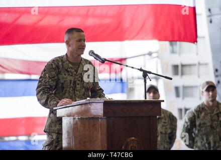 DIEGO (March 15, 2019) — Capt. David Oden, the outgoing commanding officer of the amphibious assault ship USS Makin Island (LHD 8), delivers his remarks during a change of command ceremony held in the ship’s well deck. Makin Island, homeported in San Diego, is conducting a depot-level maintenance availability. Stock Photo