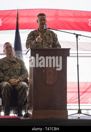 DIEGO (March 15, 2019) — Capt. David Oden, the outgoing commanding officer of the amphibious assault ship USS Makin Island (LHD 8), delivers his remarks during a change of command ceremony held in the ship’s well deck. Makin Island, homeported in San Diego, is conducting a depot-level maintenance availability. Stock Photo