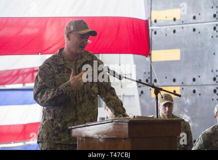 DIEGO (March 15, 2019) — Capt. Christopher Westphal, the incoming commanding officer of the amphibious assault ship USS Makin Island (LHD 8), delivers his remarks during a change of command ceremony held in the ship’s well deck. Makin Island, homeported in San Diego, is conducting a depot-level maintenance availability. Stock Photo
