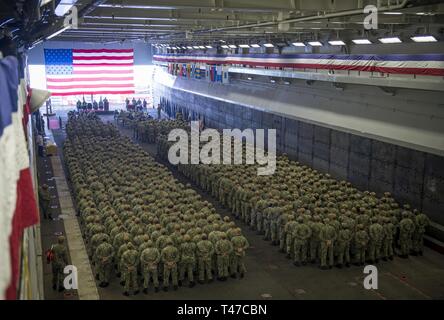 DIEGO (March 15, 2019) — Sailors assigned to the amphibious assault ship USS Makin Island (LHD 8) stand in formation during a change of command ceremony held in the ship’s well deck. During the ceremony, Capt. Christopher Westphal relieved Capt. David Oden as the commanding officer. Makin Island, homeported in San Diego, is conducting a depot-level maintenance availability. Stock Photo