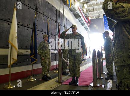 DIEGO (March 15, 2019) — Capt. Christopher Westphal, the incoming commanding officer of the amphibious assault ship USS Makin Island (LHD 8), salutes the side boys during his arrival at a change of command ceremony held in the ship’s well deck. Makin Island, homeported in San Diego, is conducting a depot-level maintenance availability. Stock Photo