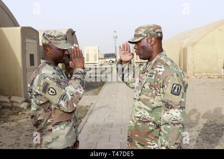 Lt. Gen. Thomas Spoehr, right, Director, Army office of Business  Transformation, Office of the Under Secretary of the Army, meets Willie  Young, Chicago Bears Linebacker, during the Chicago Bears Veterans Day at