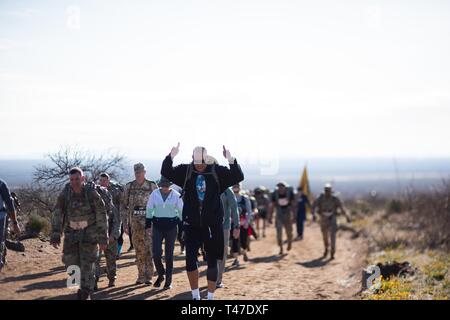 Maj. Gen. Michael Thompson, adjutant general for Oklahoma, marches alongside Oklahoma National Guard members from around the state, joining more than 8,600 people from around the world during the 30th annual Bataan Memorial Death March, Sunday. The March, established in 1989, honors the heroic service members who defended the Philippine Islands during World War II, sacrificing their freedom, health and, in many cases, their lives. Stock Photo