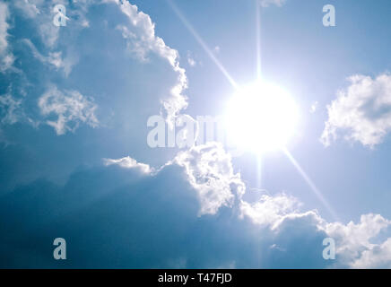 Beautiful scenic view of cloudy, sunny, blue sky in sunny day. Stock Photo