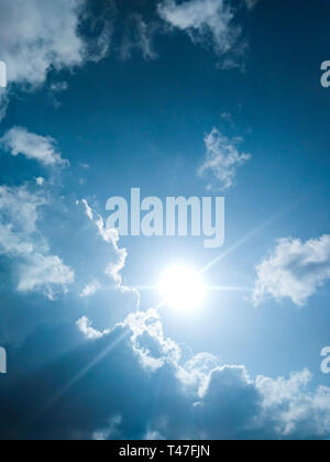 Beautiful scenic view of cloudy, sunny, blue sky in sunny day. Stock Photo