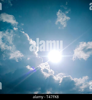 Beautiful scenic view of cloudy, sunny, blue sky in sunny day. Stock Photo