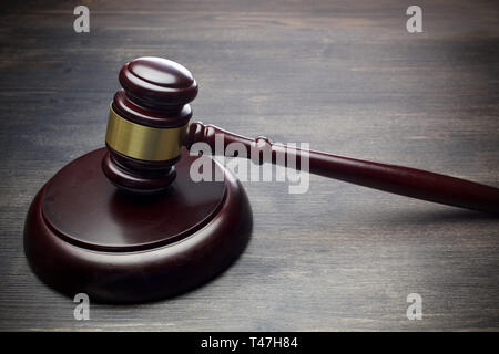 Judge's Gavel on black wooden background.Dark light Stock Photo