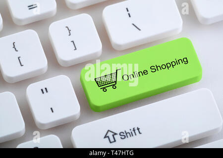 Computer keyboard with online shopping button Stock Photo
