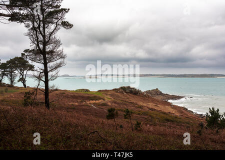 Innisidgen and the view across Crow Bar, St. Mary's, Isles of Scilly, UK, on a stormy day Stock Photo