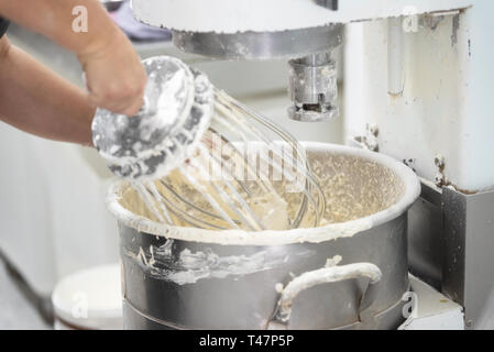 Bread Mixer In Bakery, mixing dough for baguettes in a bakery machine for  mixing dough Stock Photo - Alamy