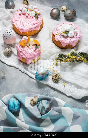 Easter composition with orthodox sweet bread, kulich and eggs on concrete background. Stock Photo