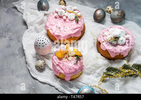 Easter composition with orthodox sweet bread, kulich and eggs on concrete background. Stock Photo