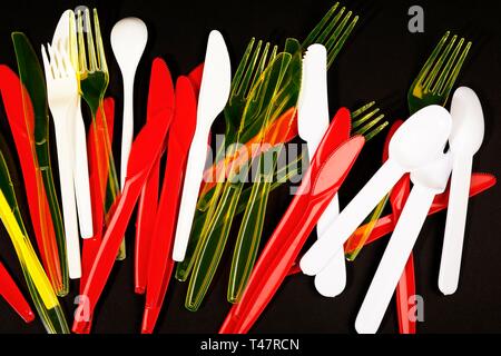 Red, yellow and white plastic cutlery, plastic knives, plastic forks, plastic spoons, plastic waste, Germany Stock Photo