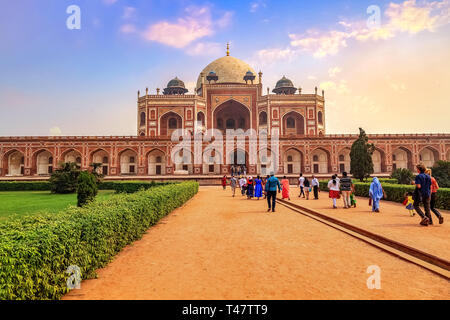 Tourists at the Humayun tomb in Delhi at sunset. Humayun Tomb is a UNESCO world heritage site and medieval architecture built in the year 1572 AD Stock Photo