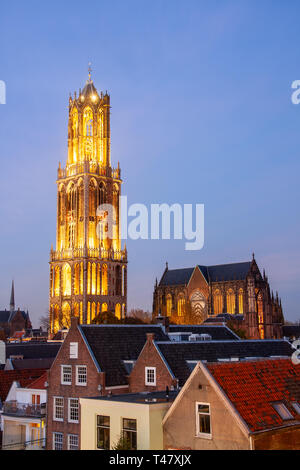 The Strosteeg (Straw Alley) and the illuminated Dom Tower of the Saint Martins Cathedral at sunset, Utrecht, The Netherlands. Stock Photo