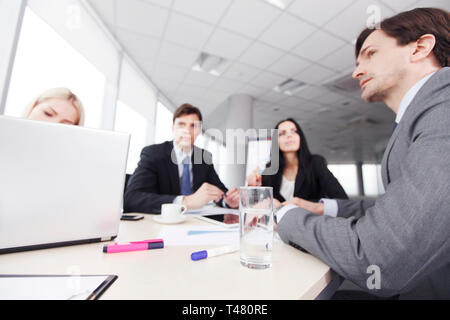 Business people analyzing financial reports in office Stock Photo