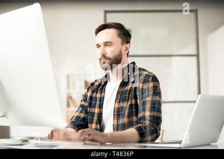 Man in front of computer Stock Photo