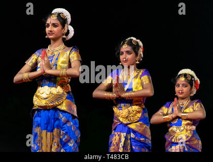 Horizontal view of beautiful Bharatanatyam dancers performing during Pongal festivities in India. Stock Photo