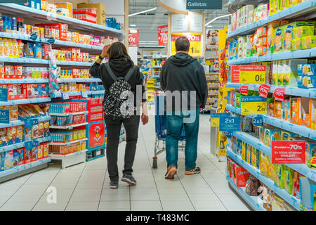 carrefour supermarket couple shopping alamy pushing cart april