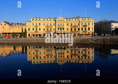 Karlstad, Sweden - April 11, 2019: Exterior view of the Elite Karlstad Stadshotell hotel with its reflection in river Klaralven. Stock Photo