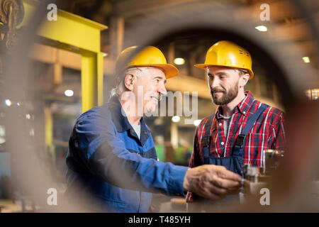 Showing how to use machine Stock Photo