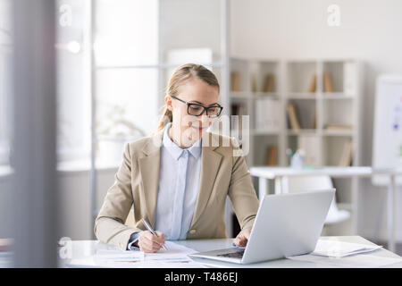 Smart lady working with data Stock Photo